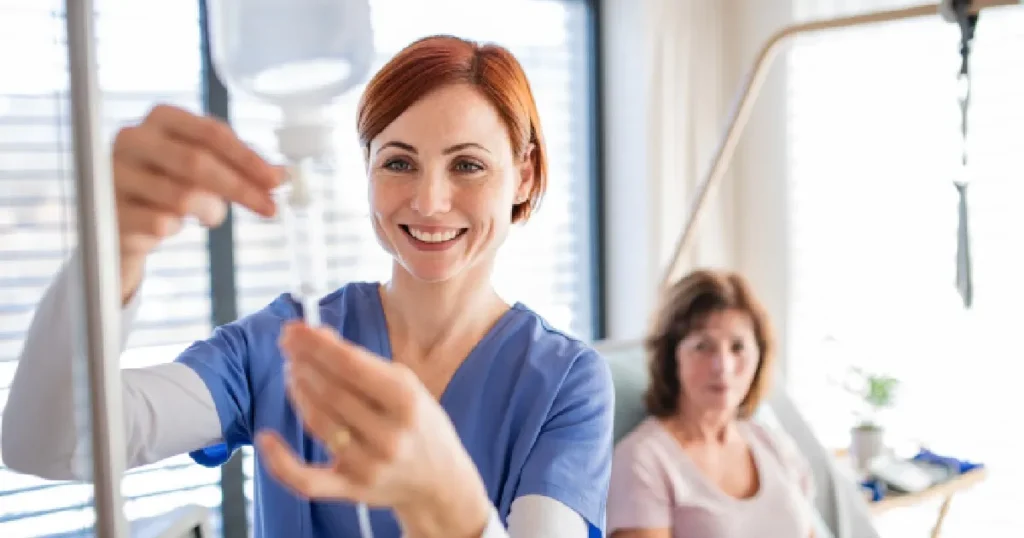 Current image: Nurse injecting IV Therapy to women Norman OK